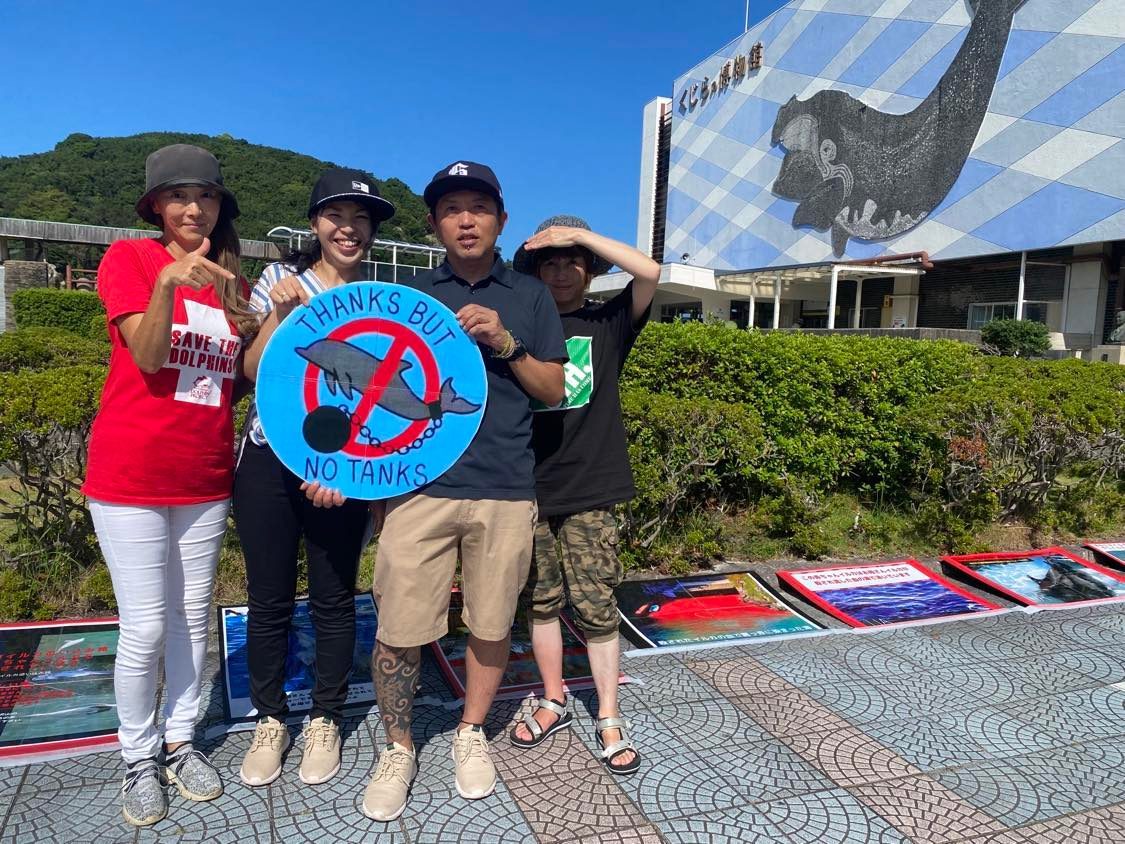 Japanese activists protest the dolphin hunts in front of the Taiji Whale Museum, Taiji, Japan.